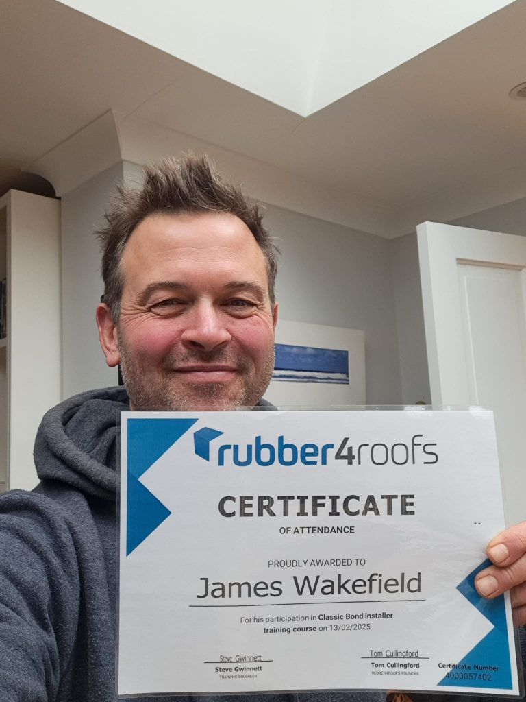 Jim holding rubber4roofs certificate